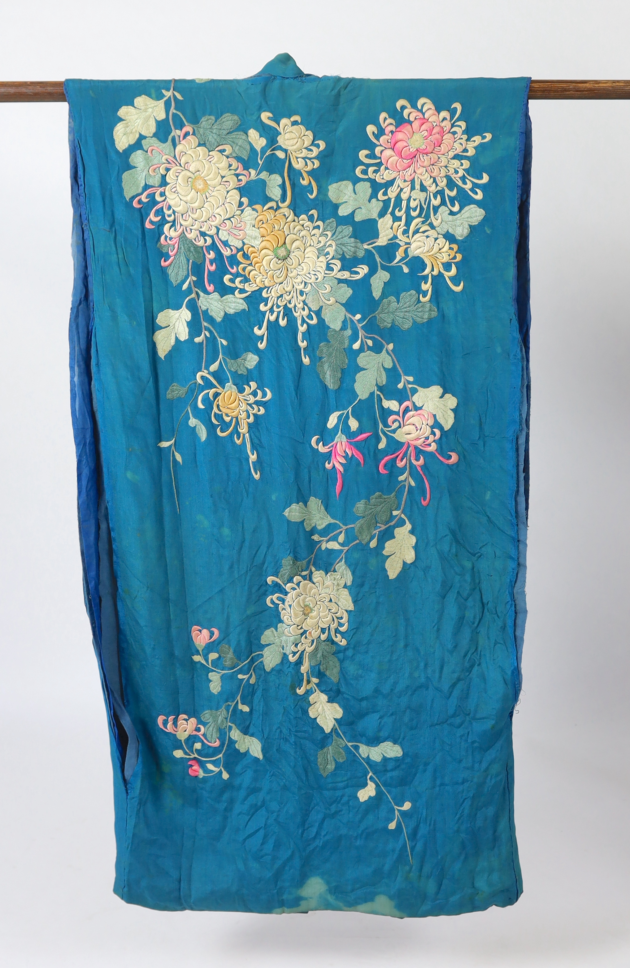 An early 20th century silk crêpe Japanese kimono and fringed tie belt, the back panel heavily embroidered with trailing chrysanthemum type flowers and leaves. This item is being sold for the back panel only and is with a